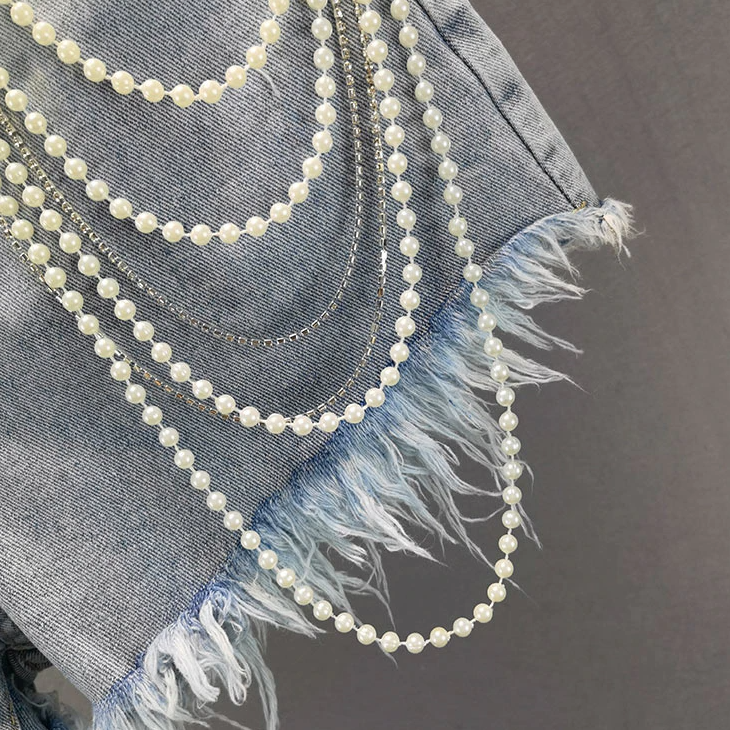 Pantalones cortos vaqueros con borlas de perlas